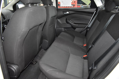Back seat interior of a car with gray upholstery