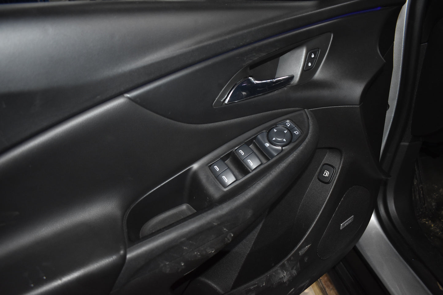 Car door panel with window and door handle controls