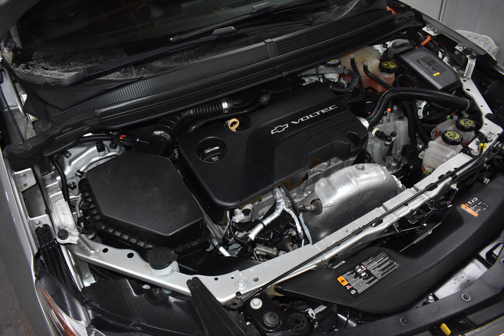Car engine with Volvo logo open hood