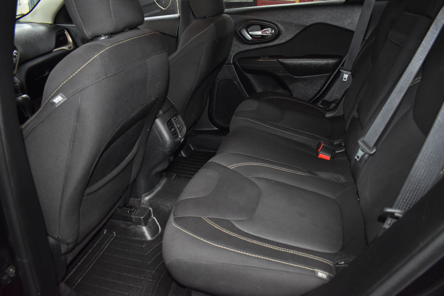 Black car interior with seats and door panel