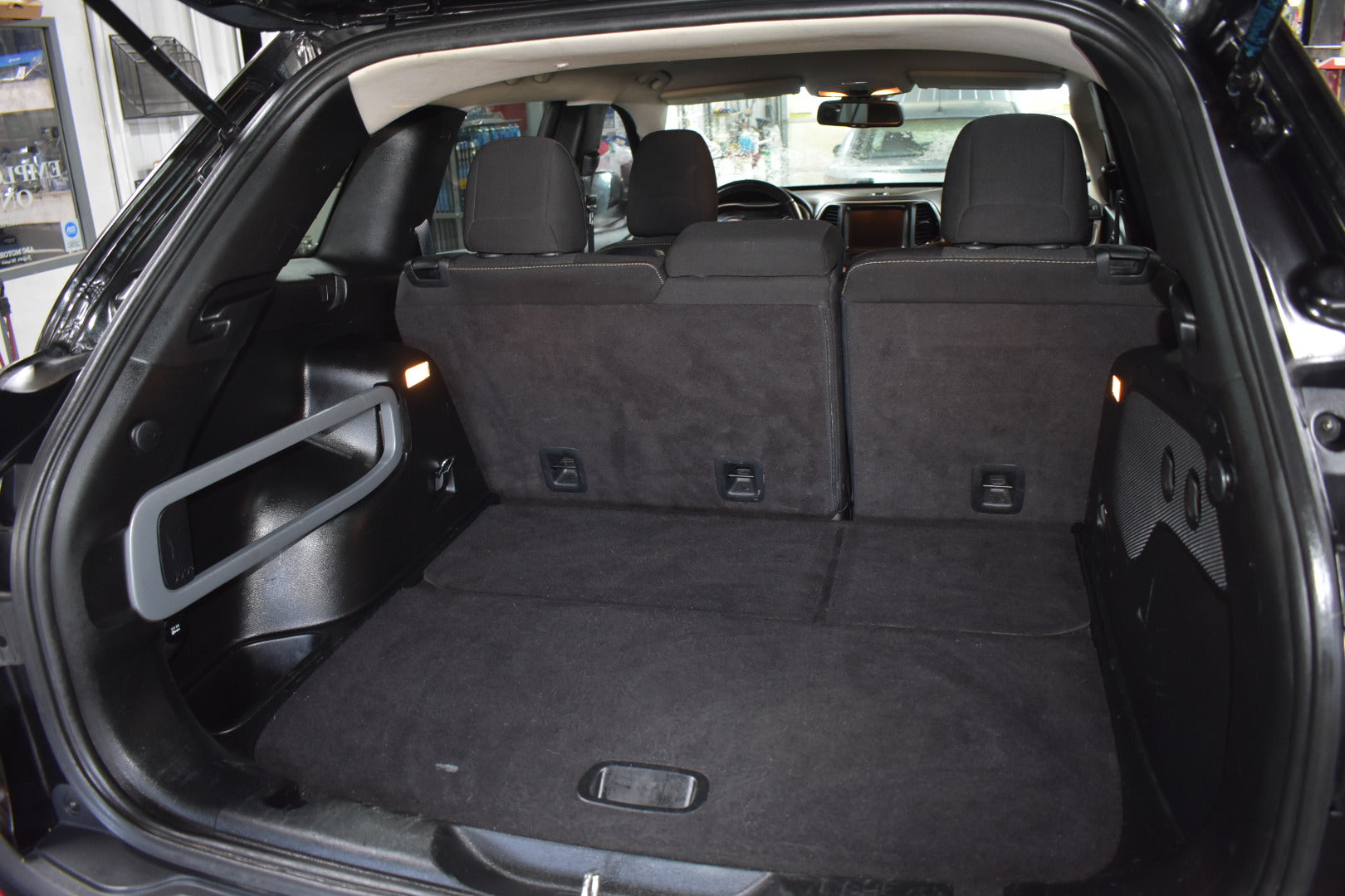 Car trunk with folded rear seats in a vehicle