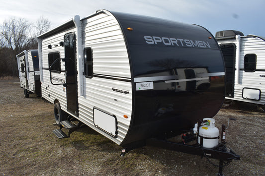 Line of travel trailers with a prominent 'Sportsmen' model in the foreground.