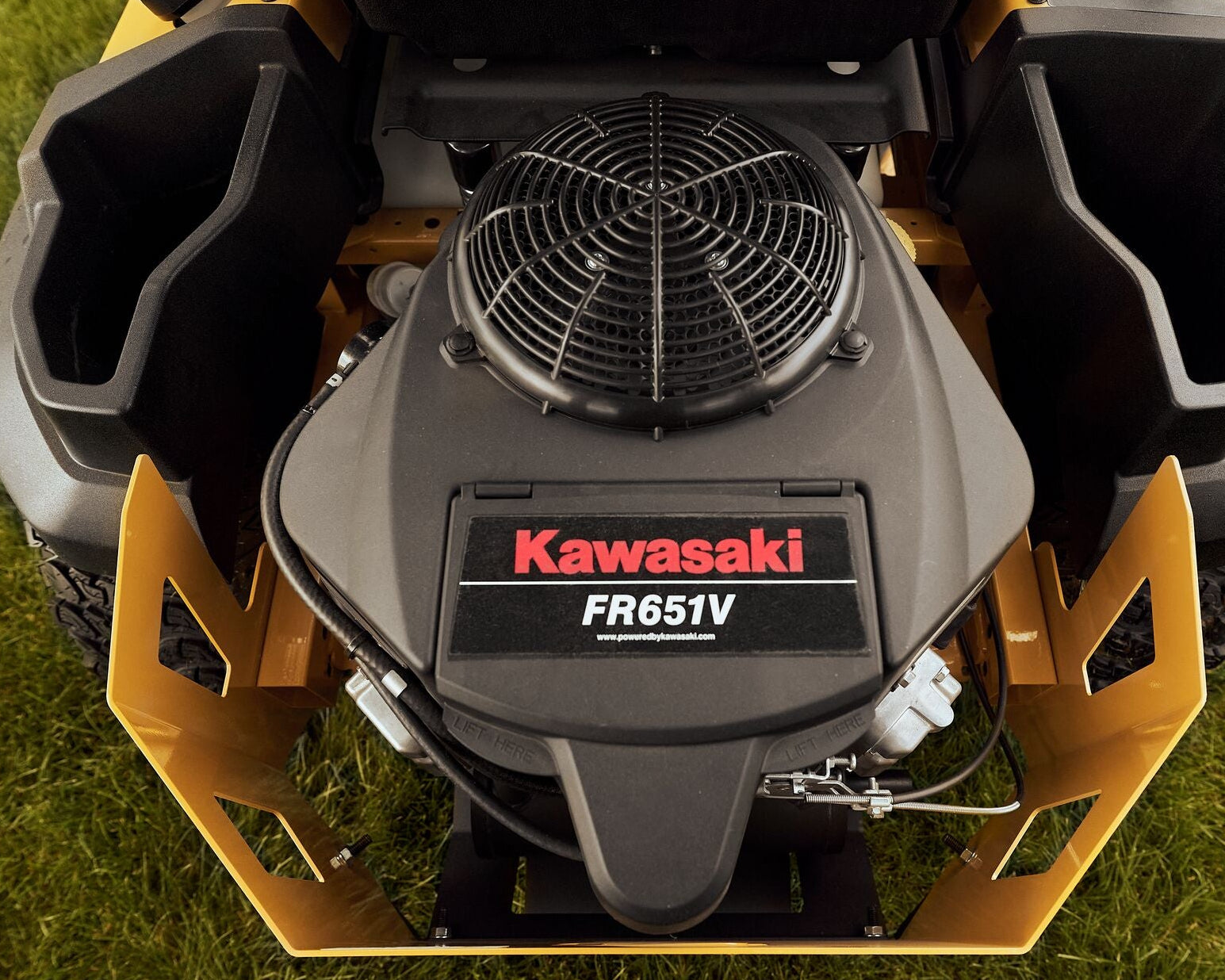 Kawasaki FR651V engine on a lawn mower with grass in the background