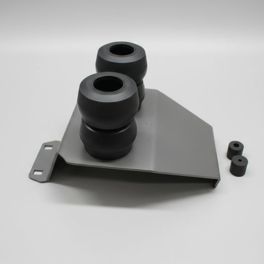 Mechanical component with two cylindrical parts on a gray surface